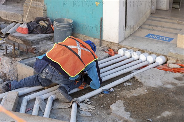 Oaxaca, Mexico, Workers rebuild Carlos Maria Bustamante Street in the center of Oaxaca City. Most of the work is being done by hand, Central America