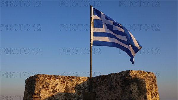 Evening light, Corner tower, Greek national flag, Frangokastello, Venetian fortress, Zwingburg, Sfakia, West Crete, South coast, Island of Crete, Greece, Europe