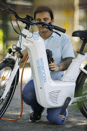 Pilot project for the production and application of green hydrogen (gH2) in the field of micromobility (cargo bikes) to save CO2. University of Rio de Janeiro. A bicycle is refuelled with hydrogen. Rio de Janeiro, 22.07.2024. Photographed on behalf of the Federal Ministry for Economic Cooperation and Development
