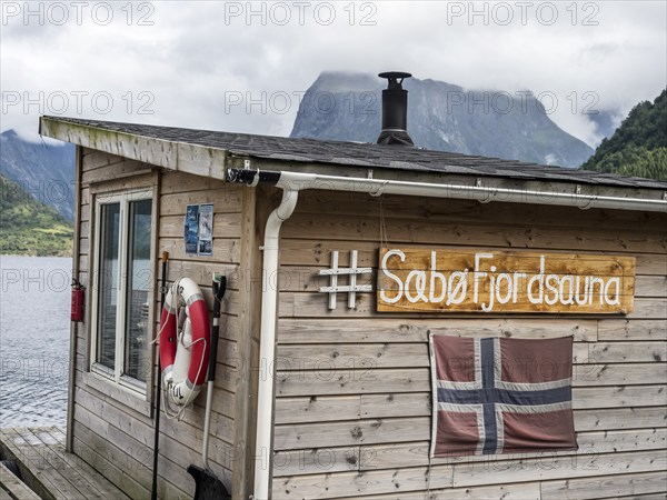 Floating sauna, marina of village Saebo at the Hjørundfjord, Norway, Europe