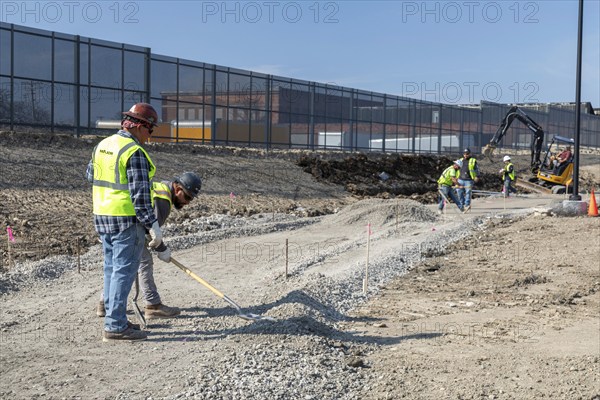 Detroit, Michigan, Workers build walkways on a section of the Joe Louis Greenway. When complete, the Greenway will be a 27.5-mile bicycle/walking trail that will circle much of the city and parts of Highland Park, Hamtramck, and Dearborn. This section was formerly a railway