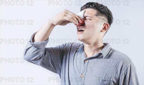Man suffering from sinusitis isolated. People suffering with irritated nose isolated. Concept of nasal congestion