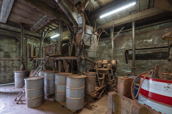 Metal barrels in the bronze powder filling room of a metal powder mill, founded in 1900, Igensdorf, Upper Franconia, Bavaria, Germany, Europe