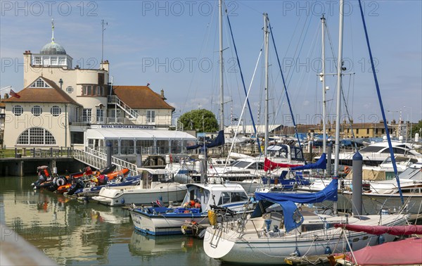 Yachts at moorings in harbour of Royal Norfolk and Suffolk yacht Club, Lowestoft, Suffolk, England, UK