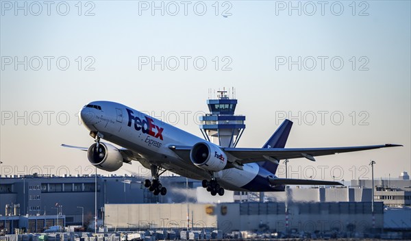 FedEx cargo aircraft, Boeing 777-FS2, taking off at Cologne-Bonn Airport, North Rhine-Westphalia, Germany, Europe