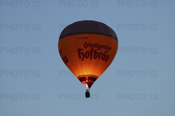 A hot air balloon from Stuttgarter Hofbräu takes to the skies in the morning, Stuttgart, Baden-Württemberg, Germany, Europe