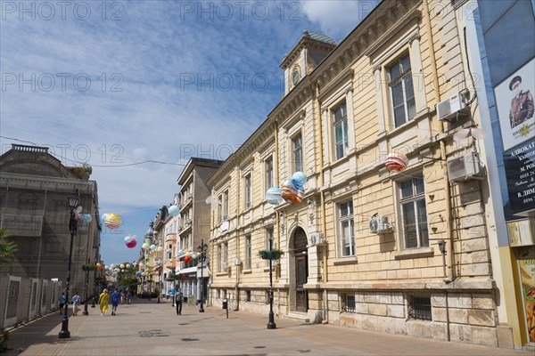 A lively city street with historic architecture and balloon decorations on a sunny day, pedestrian zone Alexandrovska, Russe, Ruse, Pyce, Bulgaria, Europe