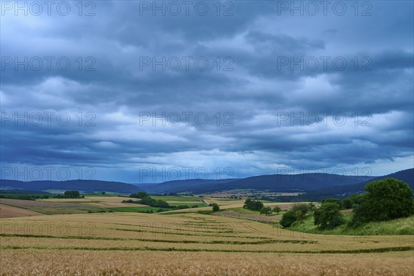 Wide landscape with fields and hills under a cloudy sky, summer, Mönchberg, Miltenberg, Spessart, Bavaria, Germany, Europe