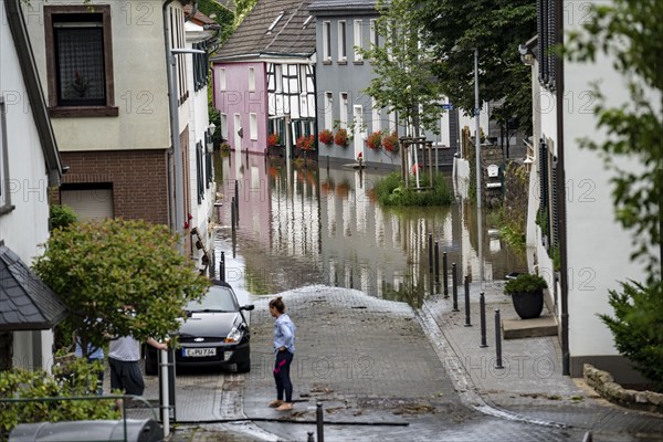 Ruhr flood near Essen-Kettwig, district Vor der Brücke, flooded road, flood on the Ruhr, after long heavy rainfall the river left its bed and flooded the countryside and villages, the highest water level ever measured, North Rhine-Westphalia, Germany, Europe