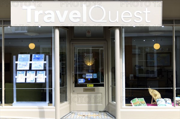 Travel Quest travel agent shop window in Woodbridge, Suffolk, England, UK