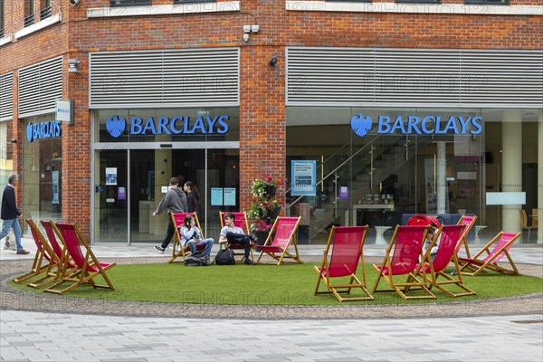 Pedestrianised area with deckchairs outside Barclays bank, Parkway shopping centre, Newbury, Berkshire, England, UK
