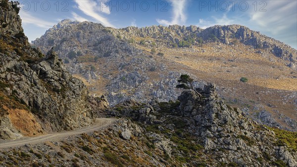 Mountain landscape with mountain road and blue sky, sky has been replaced, Kallikratis, Kallikratis Gorge, Sfakia, West Crete, Crete, Greek Islands, Greece, Europe