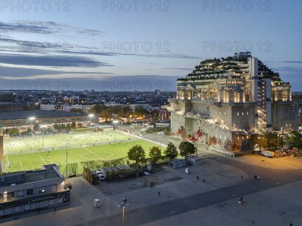 Aerial view of the Hamburg Bunker with green terraces and modern architecture in the evening cityscape at the blue hour, Heiligengeistfeld, St. Pauli, Altona, Hamburg, Germany, Europe