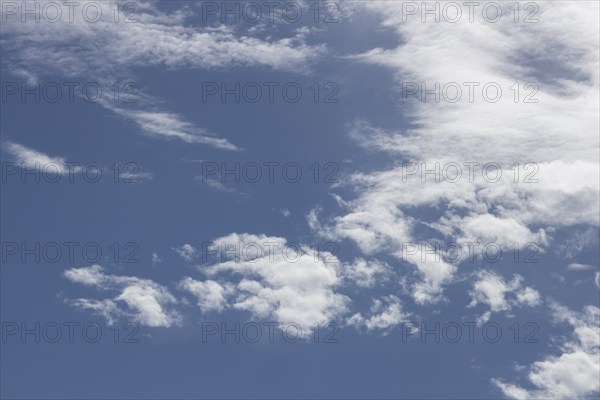 Stratocumulus white clouds in a blue sky, England, United Kingdom, Europe
