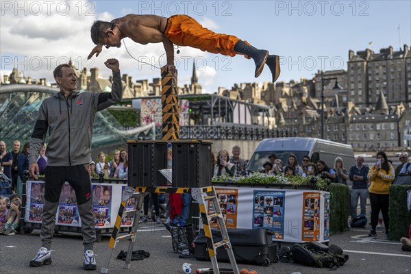 Street performers and spectators, acrobatic performance, Prince Street, world's largest cultural festival The Fringe, Edinburgh, Scotland, United Kingdom, Great Britain, Europe
