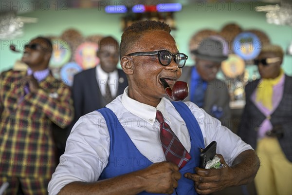 Sapeuse, member of the Société des Ambianceurs et des Personnes élégantes (SAPE), society of entertainers and stylish people, Brazzaville, Republic of Congo