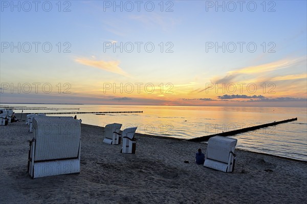 Beach chairs on the beach of the island of Poel at sunset, Mecklenburg-Vorpommern, Germany, Europe