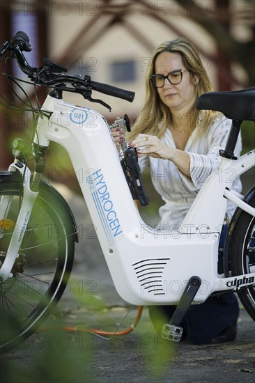 Pilot project for the production and application of green hydrogen (gH2) in the field of micromobility (cargo bikes) to save CO2. University of Rio de Janeiro. A bicycle is refuelled with hydrogen. Rio de Janeiro, 22.07.2024. Photographed on behalf of the Federal Ministry for Economic Cooperation and Development