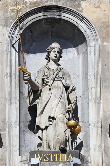Historic City Hall Stadhuis on the Grote Markt, detailed view of the allegorical statue of Justice with sword and scales on the façade, UNESCO World Heritage Site, Antwerp, Belgium, Europe