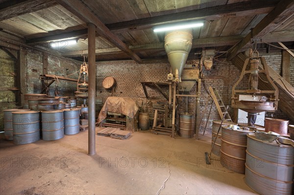Metal barrels in the bronze powder filling room of a metal powder mill, founded in 1900, Igensdorf, Upper Franconia, Bavaria, Germany, Europe