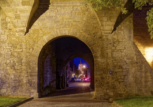 The Galgentor gate illuminated at night on the edge of the old town centre of Rothenburg ob der Tauber. Rothenburg, Bavaria, Germany, Europe
