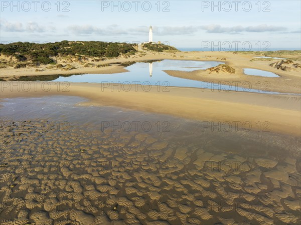Cape Trafalgar at the Atlantic Ocean at low tide. Aerial view. Drone shot. Costa de la Luz, Cádiz province, Andalusia, Spain, Europe