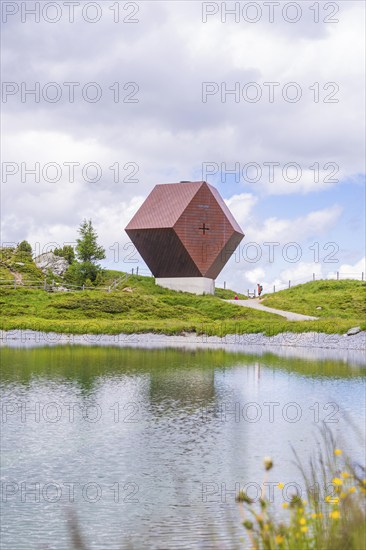 Modern architectural building on a quiet lakeshore, nestled in nature under a cloudy sky, Penken, Zillertal, Austria, Europe