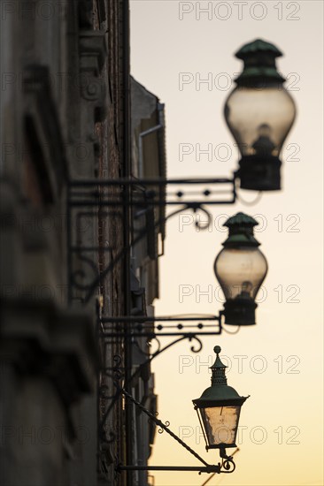 Silhouette of historic street lamps or street lanterns in the evening light, nostalgic atmosphere, Copenhagen, Denmark, Europe