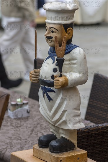 Cooking figure in front of a restaurant, Burano, Veneto, Italy, Europe