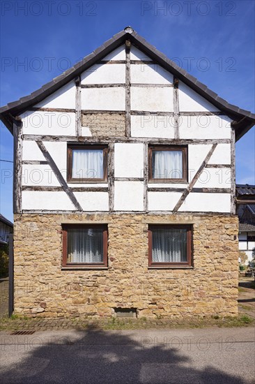 Half-timbered house on a sandstone plinth in the district of Pesch, Nettersheim, Eifel, Euskirchen district, North Rhine-Westphalia, Germany, Europe