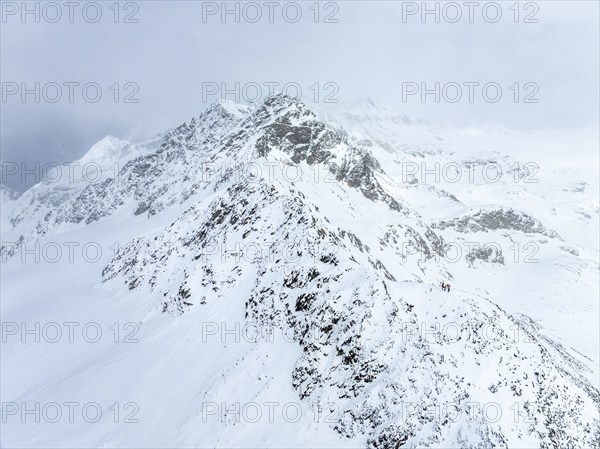 Aerial view, Snowy mountain landscape in fog, Ortler group, Trento, Italy, Europe