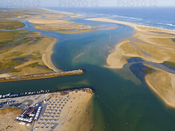 Wide estuary merging into the sea with beaches and boats along the coast, aerial view, Fuseta, Fuzeta, Faro, Algarve, Portugal, Europe