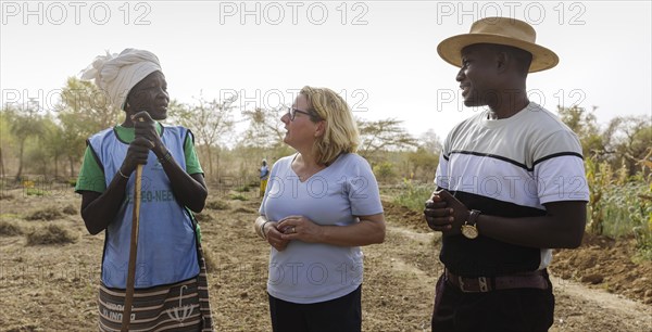 From right: Abdoul Razal Belemgnegre, head of the training centre, Svenja Schulze (SPD), Federal Minister for Economic Cooperation and Development and a female builder at the agroecological training centre Centre Beo-Noree in Beo-Noree, 04.03.2024.Photographed on behalf of the Federal Ministry for Economic Cooperation and Development