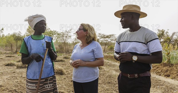 From right: Abdoul Razal Belemgnegre, head of the training centre, Svenja Schulze (SPD), Federal Minister for Economic Cooperation and Development and a female builder at the agroecological training centre Centre Beo-Noree in Beo-Noree, 04.03.2024.Photographed on behalf of the Federal Ministry for Economic Cooperation and Development