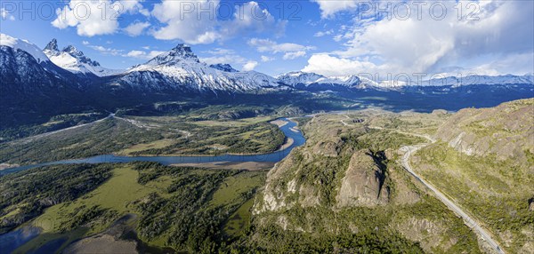 Confluence of river Estero Parada flowing into Rio Ibanez, aerial view, snow-capped mountains in early spring, Patagonie, Chile, South America