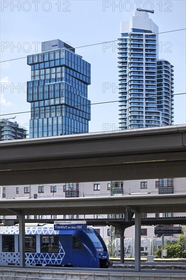 Main railway station with local train with the skyscrapers The Spin and Grand Tower, Frankfurt am Main, Hesse, Germany, Europe