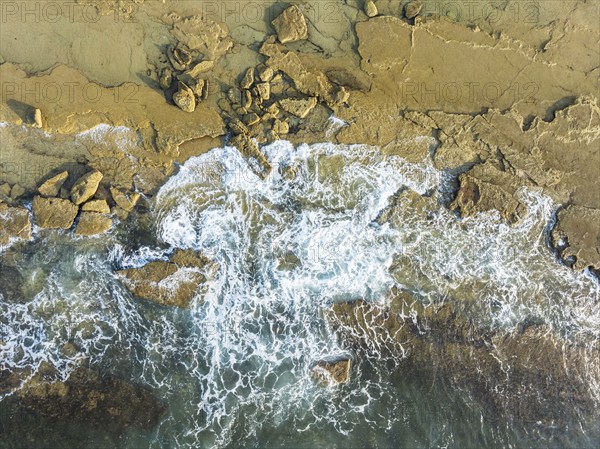 Breakers at the shore of the Atlantic Ocean near Cape Trafalgar. Aerial view. Drone shot. Costa de la Luz, Cádiz province, Andalusia, Spain, Europe