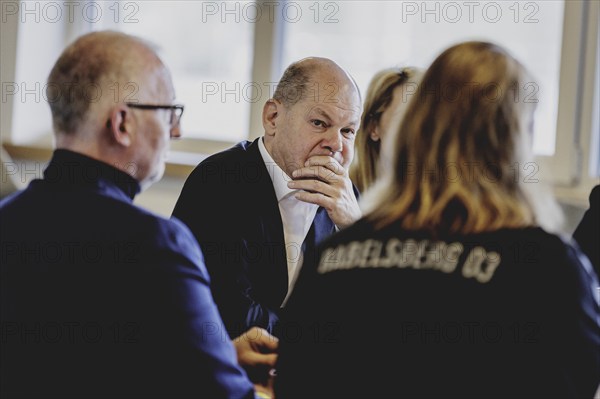 Olaf Scholz (SPD), Federal Chancellor, at a meeting with migrants and people involved in the field at SV Babelsberg in Potsdam, 26 February 2024