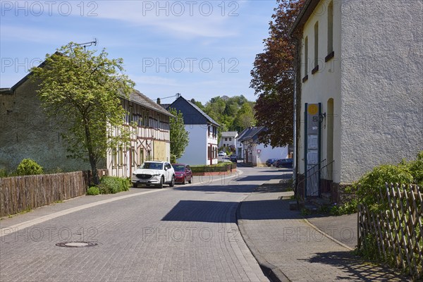 Street with residential buildings through the Schönau district, Bad Münstereifel, Eifel, Euskirchen district, North Rhine-Westphalia, Germany, Europe