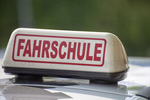 Close-up of a driving school sign in Germany