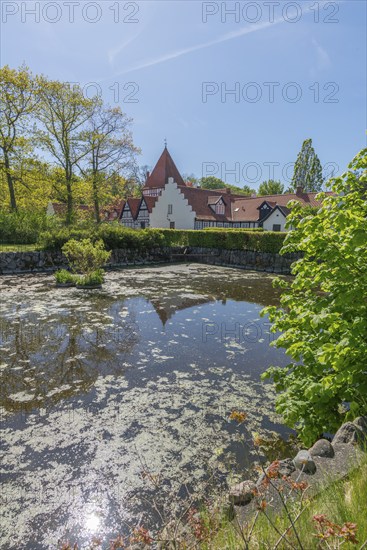 Risinge Herregaard, Ullerslev, Fyn Manor, moat, water reflection, trees, island of Funen, Denmark, Europe