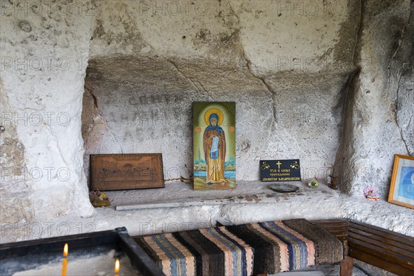Niche in a cave with religious icons and candles, Bulgarian Orthodox cave monastery, rock monastery, Basarbovsky Monastery, Basarbovsky, Basarbovo, Basarbovo, Russia, Rhodope Mountains, Bulgaria, Europe