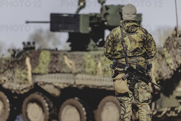 A soldier with a rifle, taken during the military exercise 'Wettiner Schwert' with German and Czech soldiers near Tangermünde, 26 March 2024. 'Wettiner Schwert' is part of the NATO Quadriga exercise
