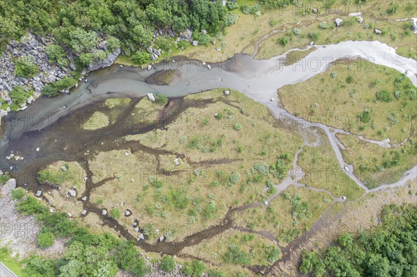 Aerial view of a small river along road Aursjovegen, a rural tourist route in the northern fjord region, Norway, Europe