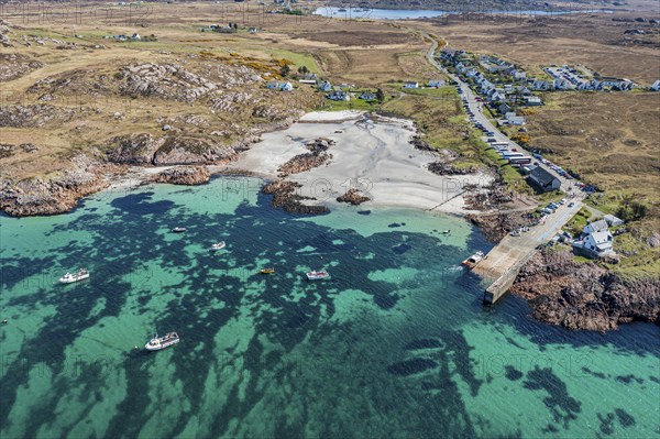 Aerial view, top down view on turquiose water at the beach of Fionnphort, boat traffic to Iona island, Scotland, UK