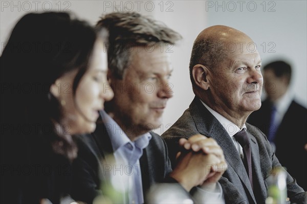 (R-L) Olaf Scholz (SPD), Federal Chancellor, Robert Habeck (Alliance 90/The Greens), Federal Minister for Economic Affairs and Climate Protection and Vice-Chancellor, and Annalena Bärbock (Alliance 90/The Greens), Federal Foreign Minister, pictured during the weekly cabinet meeting in Berlin, 21 August 2024