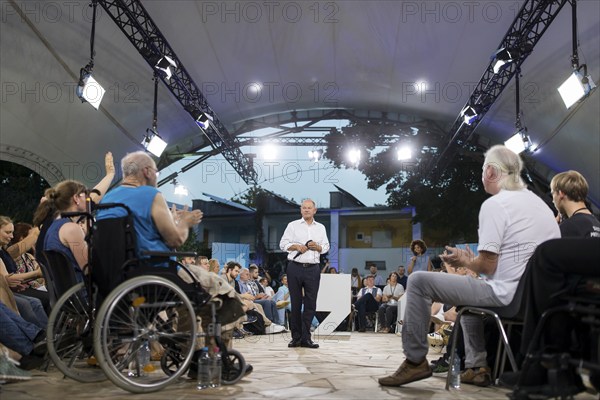 Olaf Scholz (Chancellor of the Federal Republic of Germany, SPD) surrounded by guests at the Chancellor's meeting at ufaFabrik in Berlin on 4 September 2024