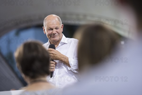 Olaf Scholz (Chancellor of the Federal Republic of Germany, SPD) surrounded by guests at the Chancellor's meeting at ufaFabrik in Berlin on 4 September 2024