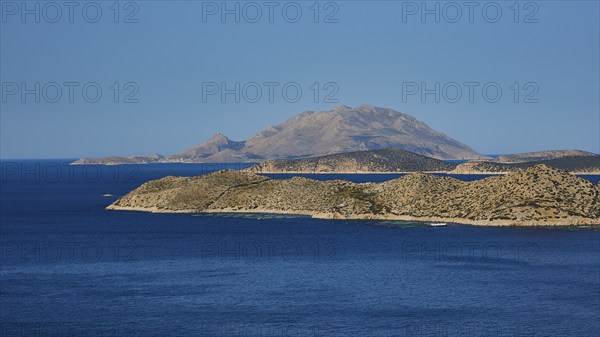 Close to a larger island in the blue sea, surrounded by blue sky and natural landscape, Makri Island, Alimia Island, Chalki Island, Kritinia Castle, St John's Castle, Kritinia, Rhodes, Dodecanese, Greek Islands, Greece, Europe