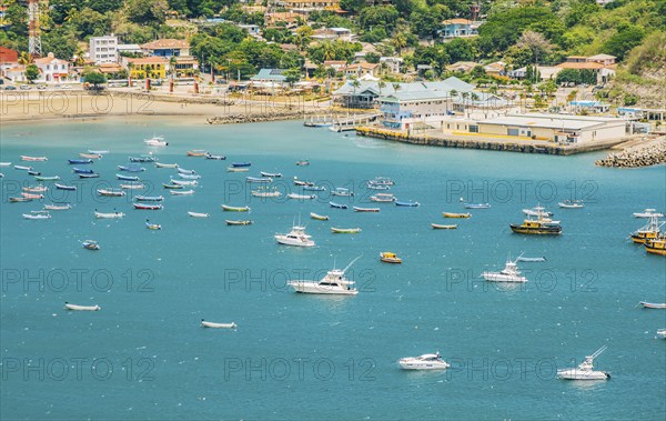 A beautiful bay with yachts and boats on the shore. Boats and yachts in the bay of San Juan del Sur